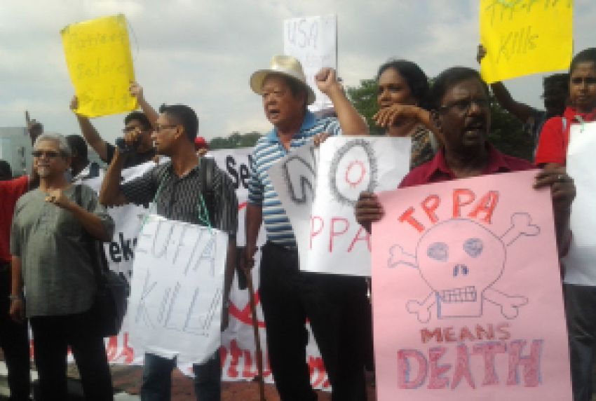 Members of the Gabungan Bantah FTA (Anti-FTA Coalition) rally against the Trans-Pacific Partnership Agreement (TPPA) deal on July 16.