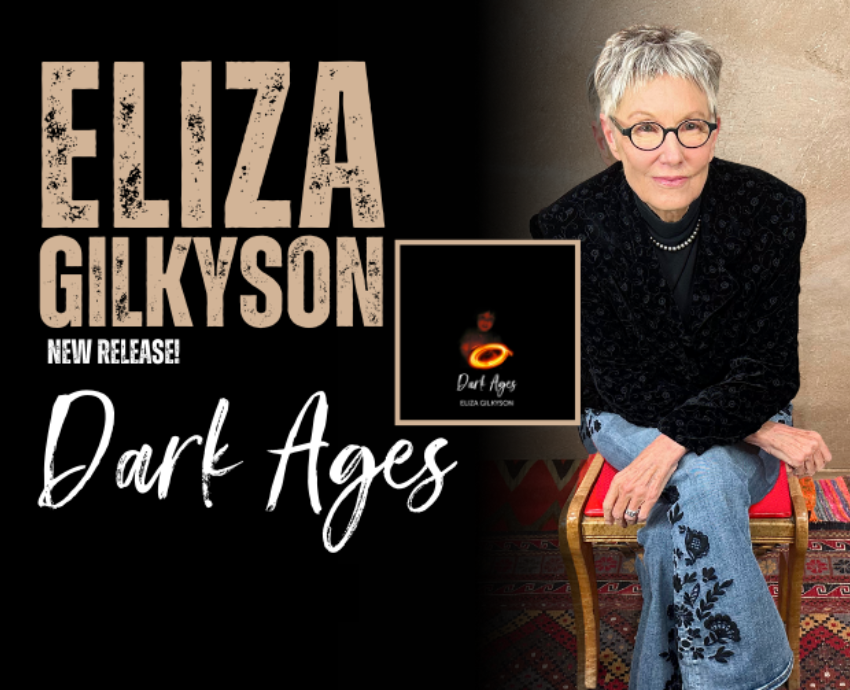 Eliza Gilkyson sitting next to album artwork