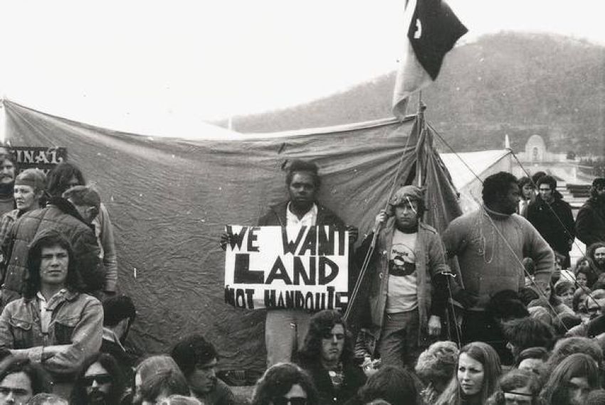 Alan Sharpley with placard, Bob Perry in a Ningla-a-Na T-shirt and John Newfong with hands on hips