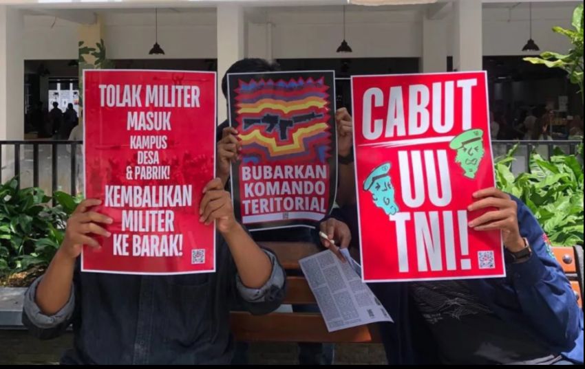 people holding signs 