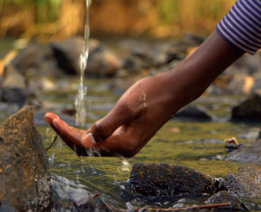 water flowing into a hand