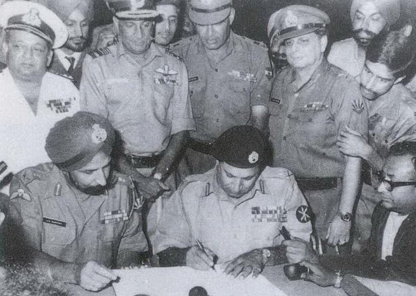 Lieutenant General Amir Niazi signs the document surrendering to Indian and Bangladeshi forces