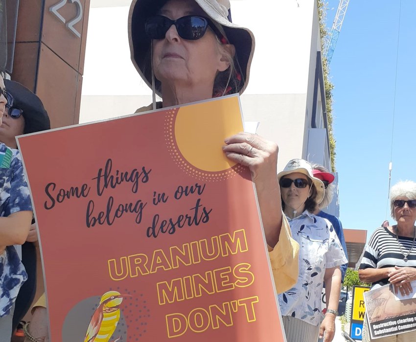 Protester holds up a sign opposing Vimy Resources' proposed uranium mine at Mulga Rock. 