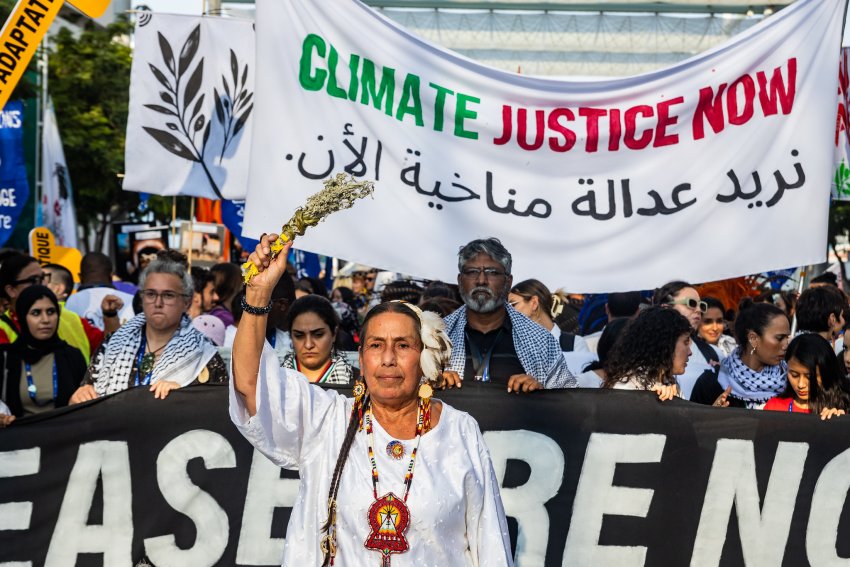 people holding signs and banners