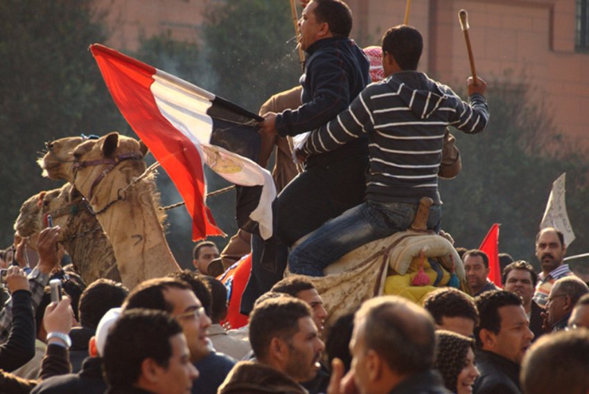 Pro-Mubarak thugs ride into the crowd of democracy protesters at Tahrir Square, Cairo, February 2.