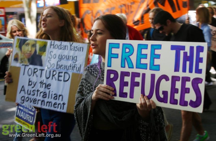Free the refugees sign