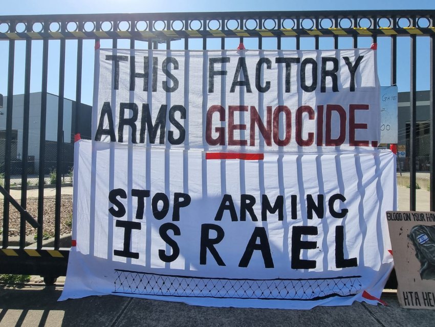 A banner hanging from the gates of the HTA plant in Naarm/Melbourne.