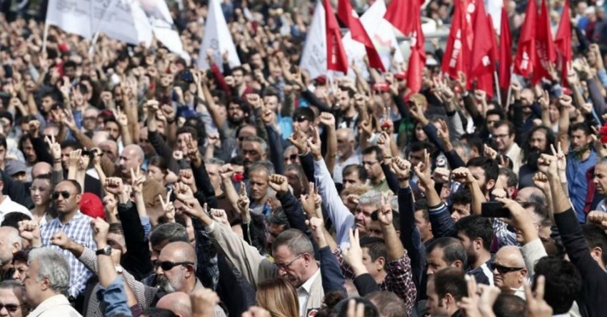 A crowd salutes victims of the Ankara bombings, October 11.