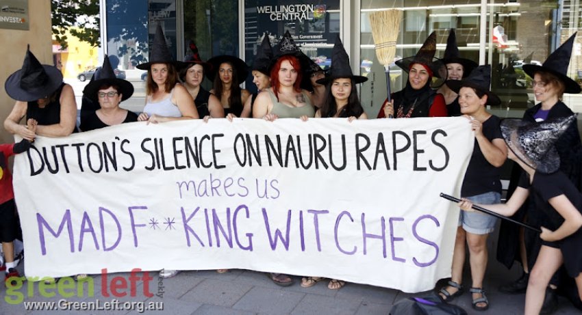 Made Fucking Witches holding banner