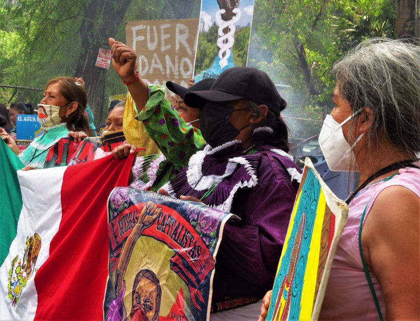 Activists march through Xochimilco, Mexico, protesting against corporations