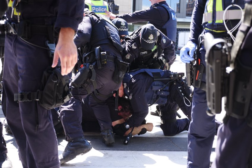 Police arrest a protester at Blockade IMARC in Melbourne on October 30. 