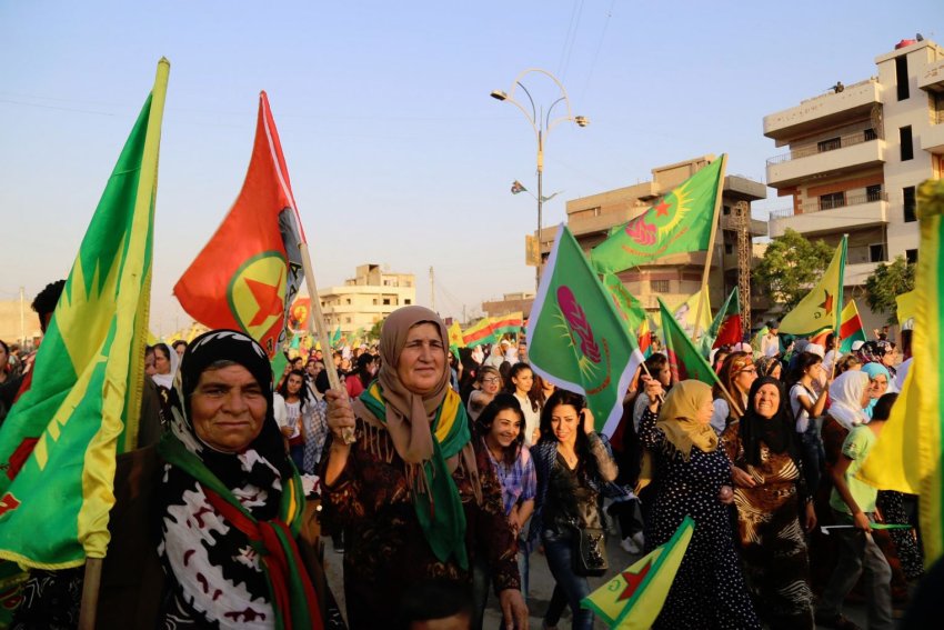 Demonstrators celebrate the anniversary of the Rojava Revolution.