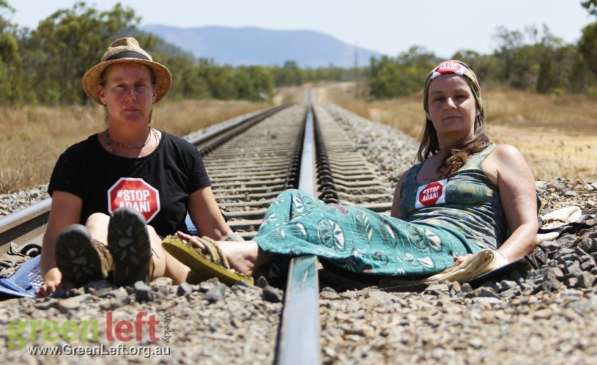 Protesters on train tracks.