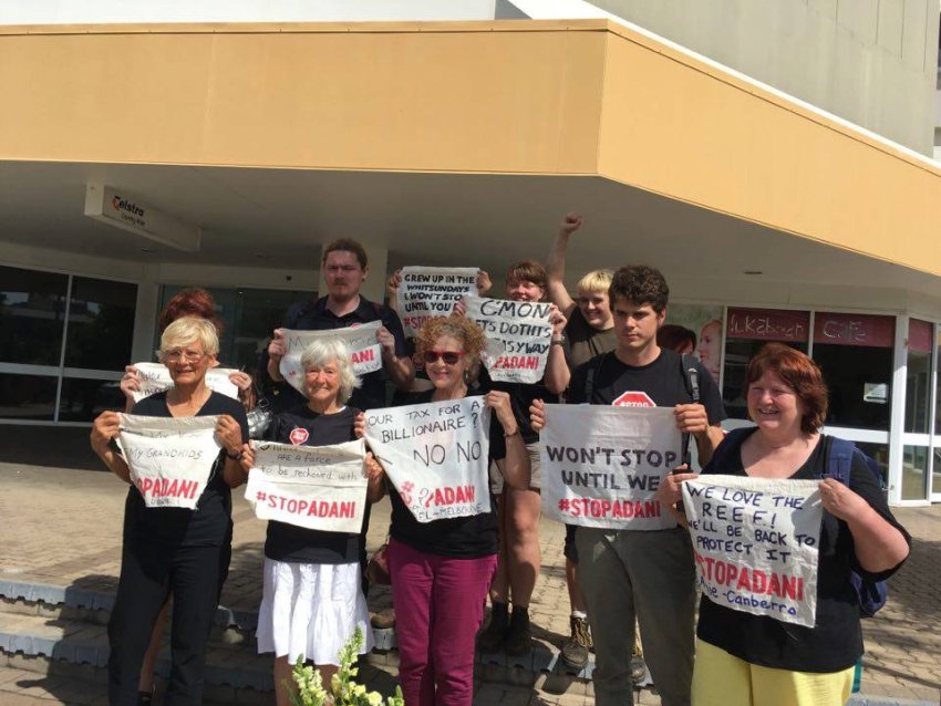 Protesters holding signs