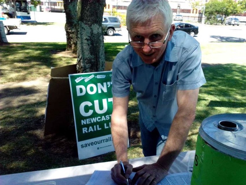 Steve O'Brien signs a petition to keep Newcastle's rail.