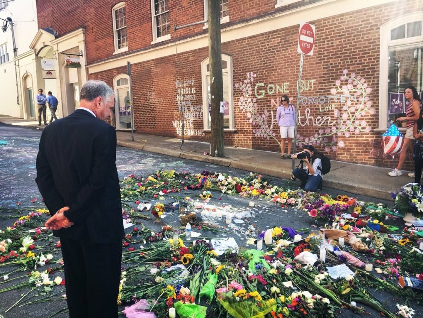 tim_kaine_inspects_a_makeshift_memorial_to_heather_heyer