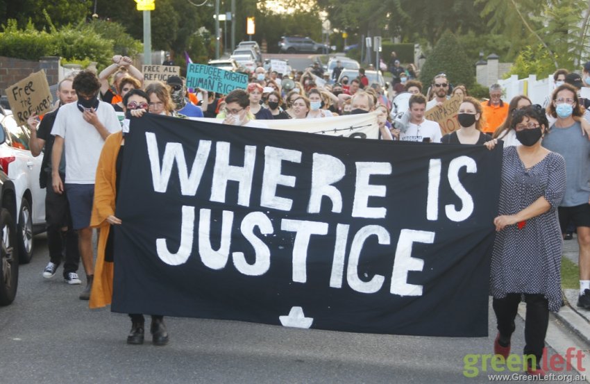 Refugee rights banner reading "Where is justice?"
