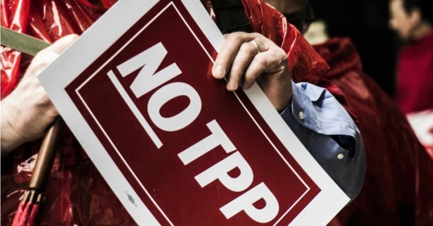 A protester holds a 'No Trump' sign.