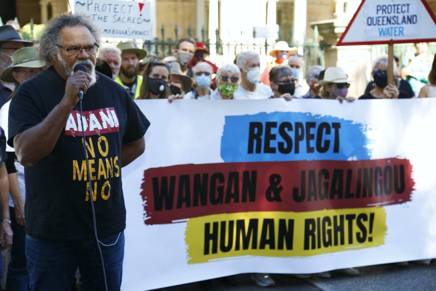 Wangan and Jagalingou senior cultural custodian Adrian Burragubba speaks to the crowd