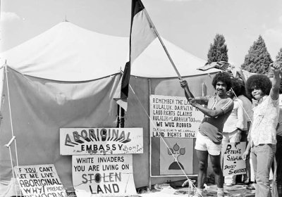 Waving the Aboriginal flag at the Aboriginal Tent Embassy 1974