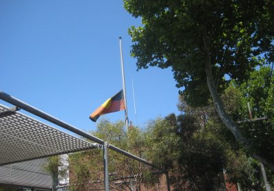 An Aboriginal flag flying at half mast.Photo: Kazadams/Wikimedia Commons