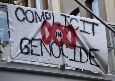 banner outside ABC says complicit in genocide