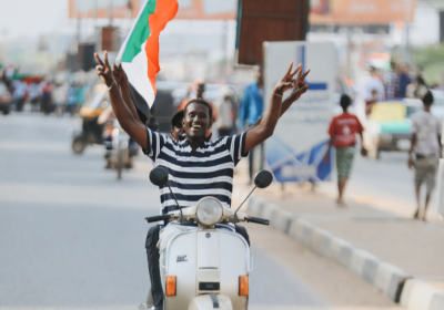 Sudanese man on a motorcycle