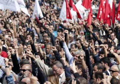 A crowd salutes victims of the Ankara bombings, October 11.
