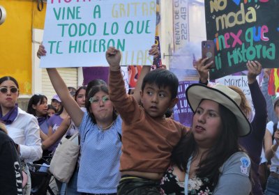 Women and children marching for International Women's Day in Puebla Mexico