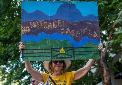 Activist holding sign that reads ‘No Narrabri gasfield’ at a November 12 climate rally in Sydney