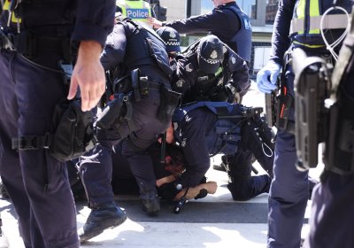Police arrest a protester at Blockade IMARC in Melbourne on October 30. 