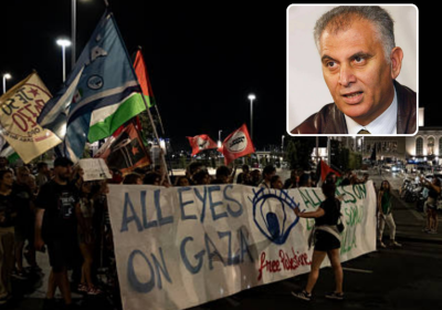 protesters with banner and inset headshot