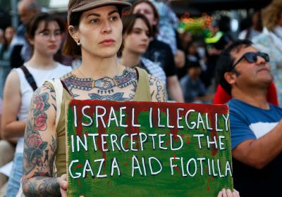 A sign reading: Israel illegally intercepted the Gaza aid flotilla