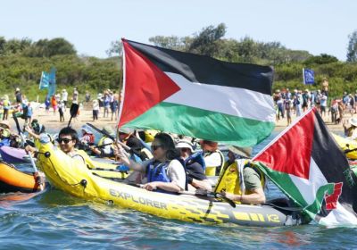 Palestine flags on kayaks