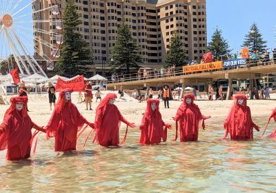 Photo of Red Rebels Brigade at Seas Are Rising protest at Glenelg Beach