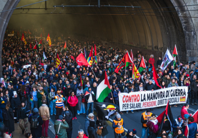 Protesters with banners against war and militarism in Italy