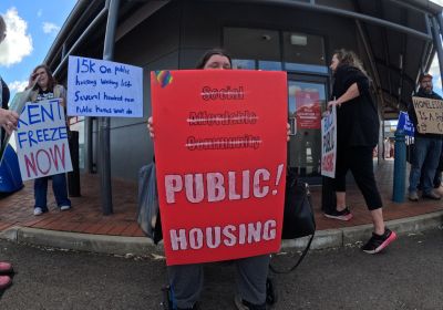 Cropped photo of housing portestors outside Nick Champion's electoral office.