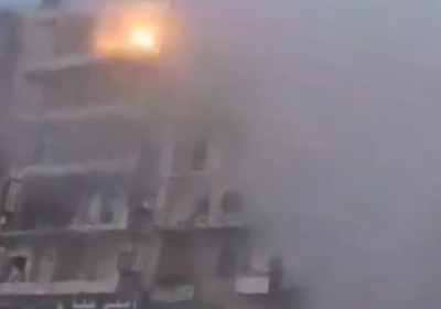 Building under attack in Aleppo
