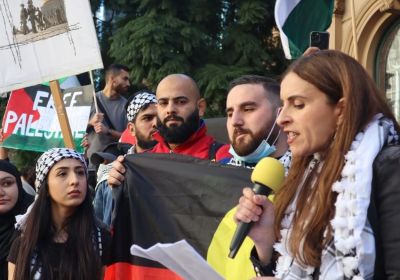 Dr Randa Abdel-Fattah addressing a Palestine solidarity rally on Gadigal Country/Sydney