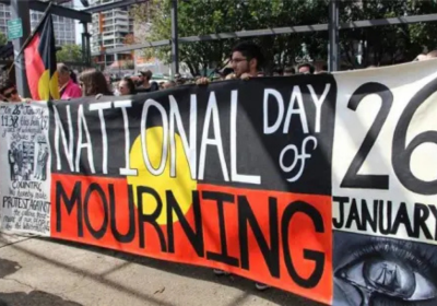 Photo of people holding banner at Sydney Day of Mourning 2016