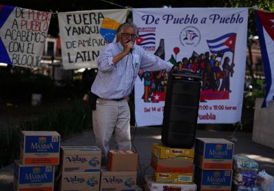 Person standing at an aid collection point in Puebla