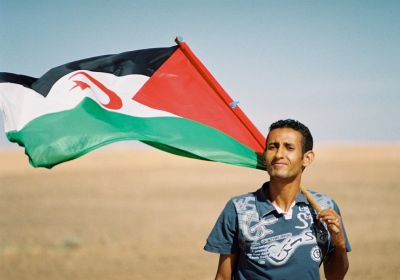 Man holding Western Sahara flag