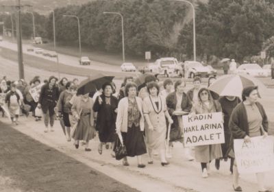 women marching with banners and signs