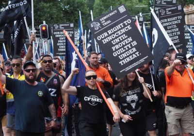 CFMEU members and supporters marching against attacks on the CFMEU