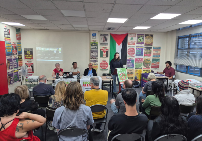 a packed room at the melbourne resistance centre for a forum on the war with iran