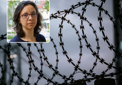 Head shot with razor wire background