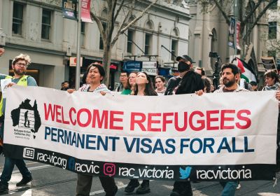 Refugee Action Collective Victoria banner at refugee rights rally in Naarm (Melbourne)