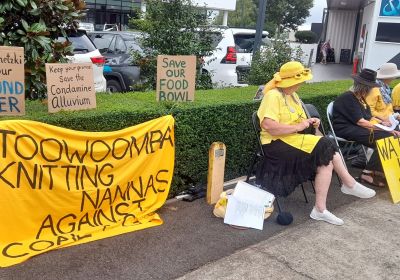 Photo of the Toowoomba Knitting Nannas Against Coal & Gas outside David Janetzki's office
