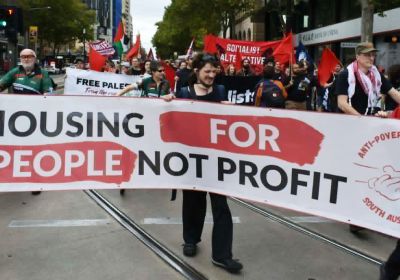 Anti-Poverty Network SA members and supporter with housing banner at protest