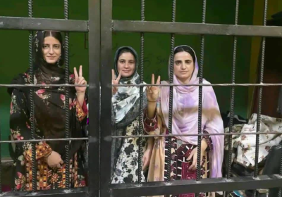 3 women behind bars